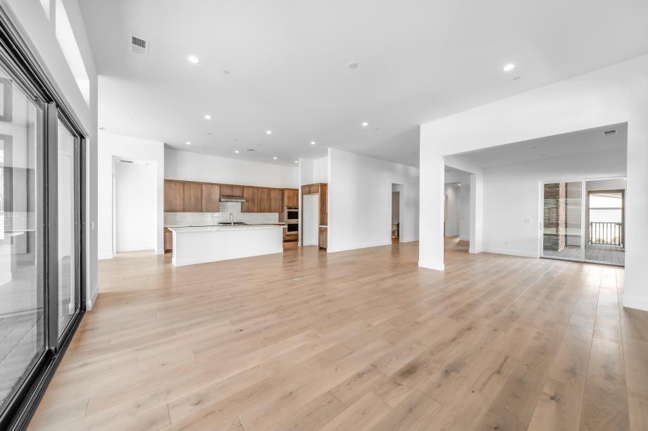 Spacious great room with a multi-sliding glass door and open space to entertain