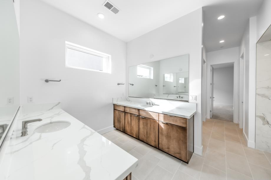 Primary bathroom with large walk-in shower and walk-in closet