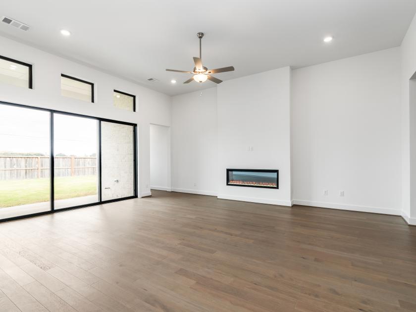Great room with fireplace and sliding glass doors to the back patio