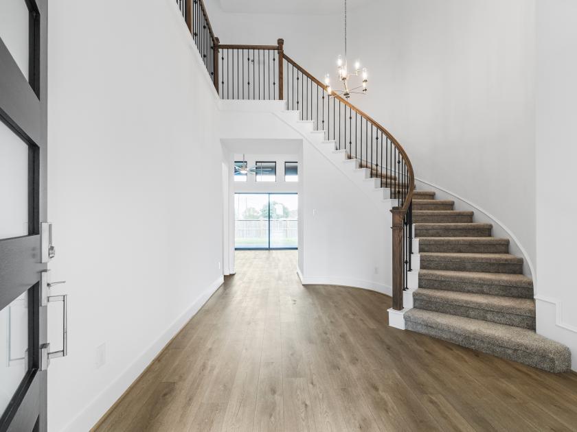 Entry with a beautiful curved staircase