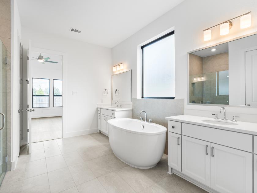 Primary bathroom with tub and walk-in shower