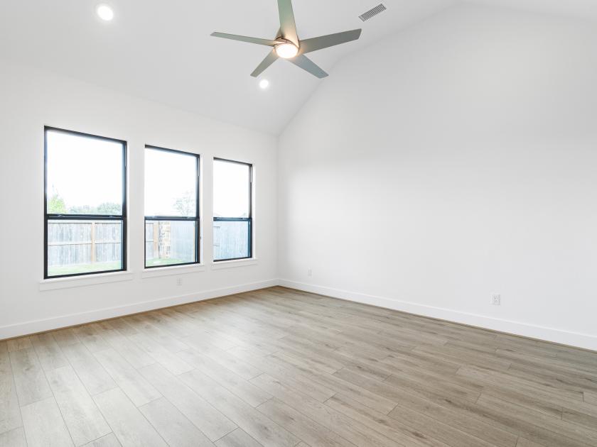 Primary suite with vaulted ceilings