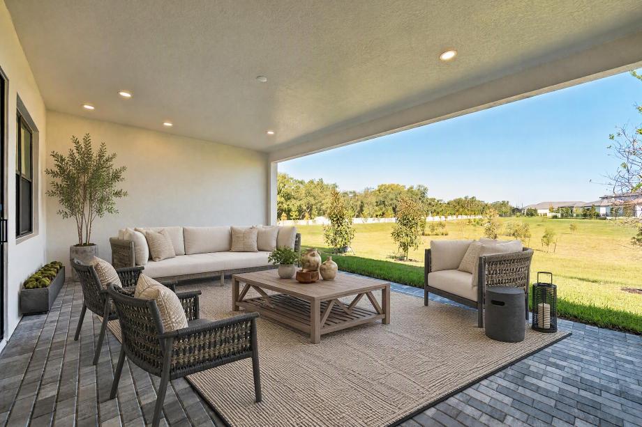Spacious covered lanai with expansive rear yard views