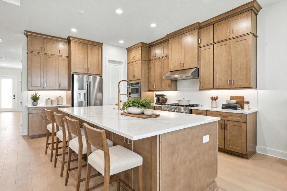 Well-appointed kitchen with expansive center island and abundant cabinetry