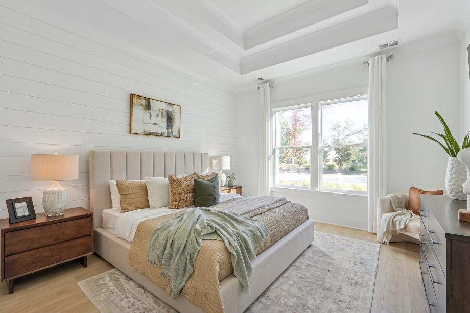Luxurious primary bedroom suite shown with optional tray ceiling