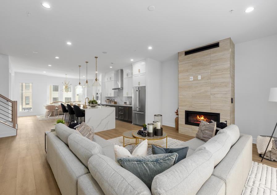 Expansive, open-concept living level with elegant fireplace