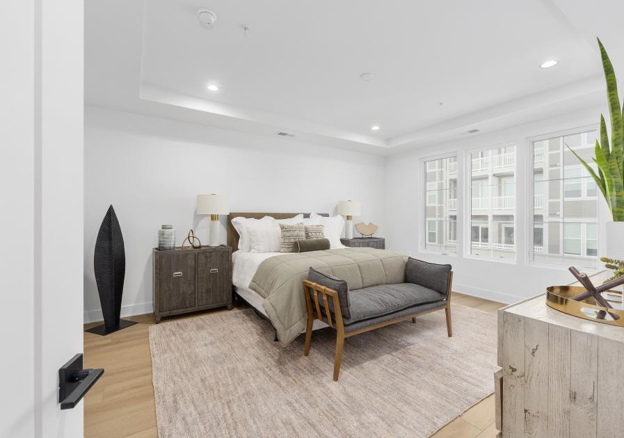 Spacious primary bedroom with plentiful light