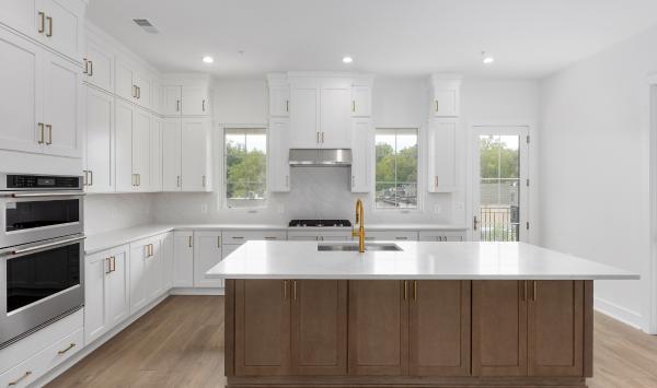 Rear kitchen with center island and abundant cabinet space