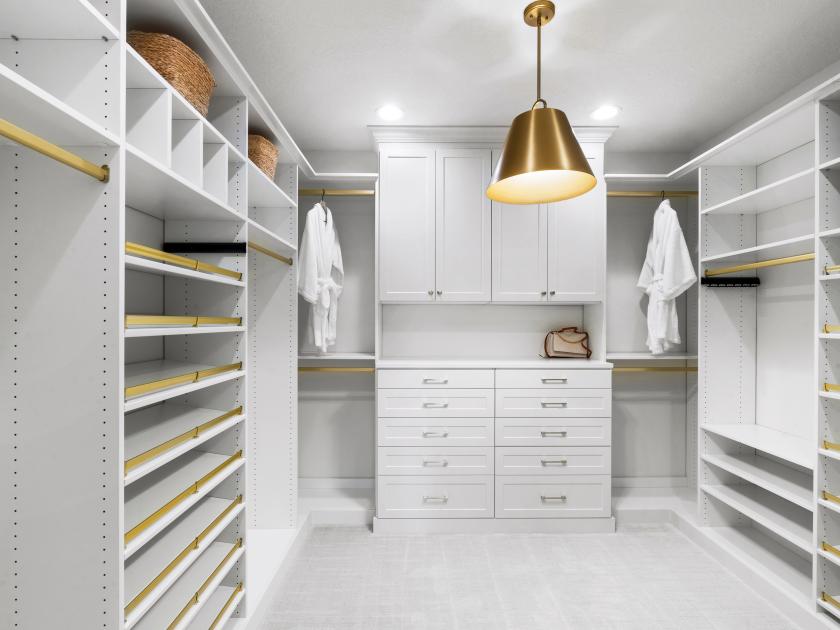 Huge walk-in closet with beautiful built-in cabinets