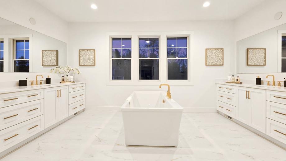 Spa-like primary bathroom with a freestanding tub