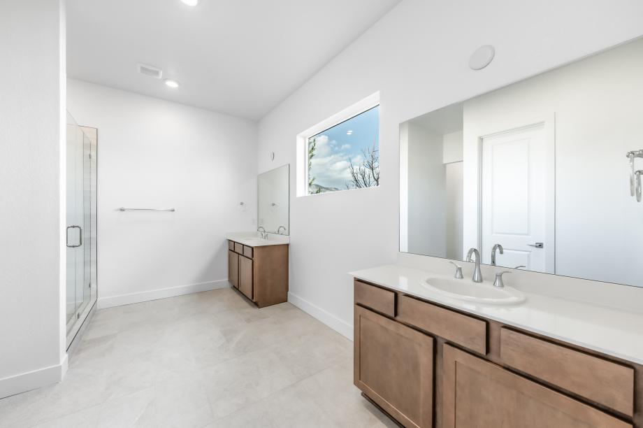 Lavish primary bathroom with a large walk-in shower