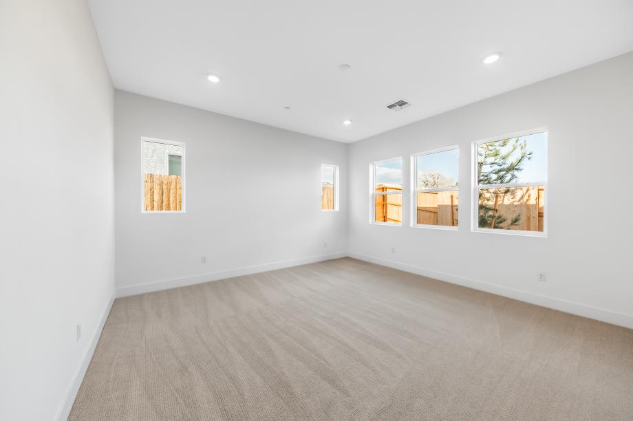 Primary bedroom suite with ample natural light