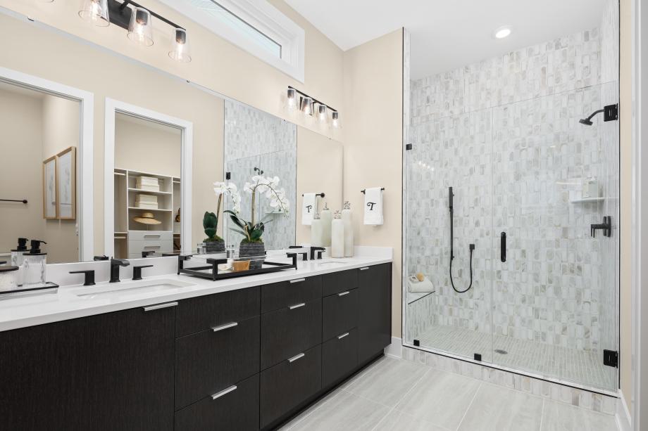 Luxurious primary bath with upgraded finishes and a zero-threshold shower