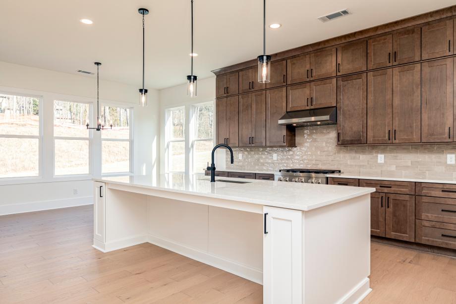 Light and bright kitchen connected to casual dining area