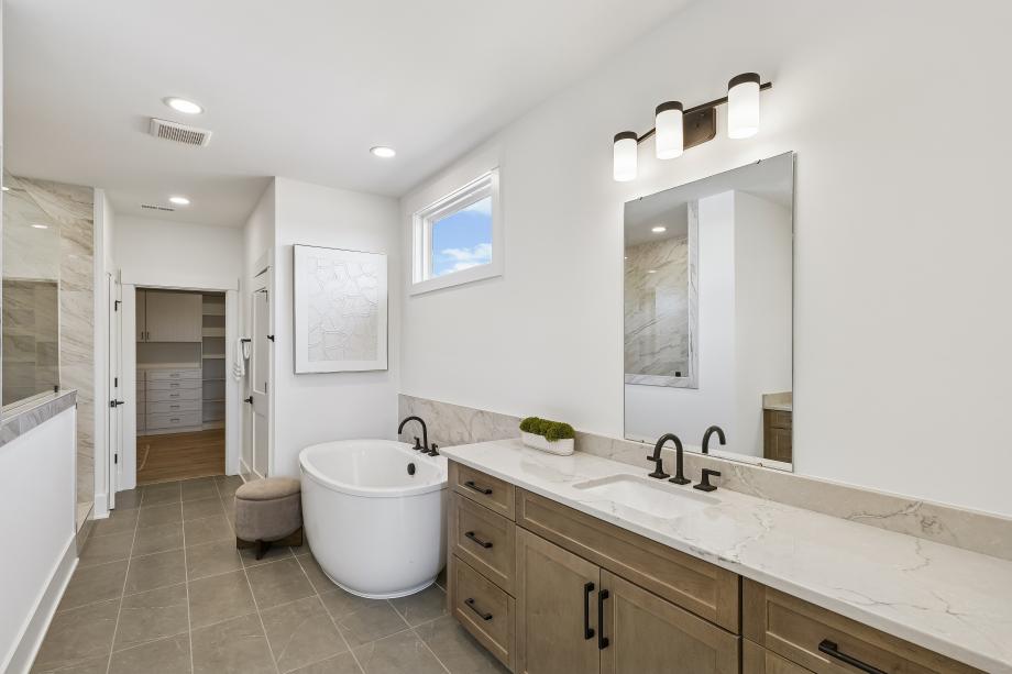 Stunning primary bathroom with dual sinks and walk-in shower