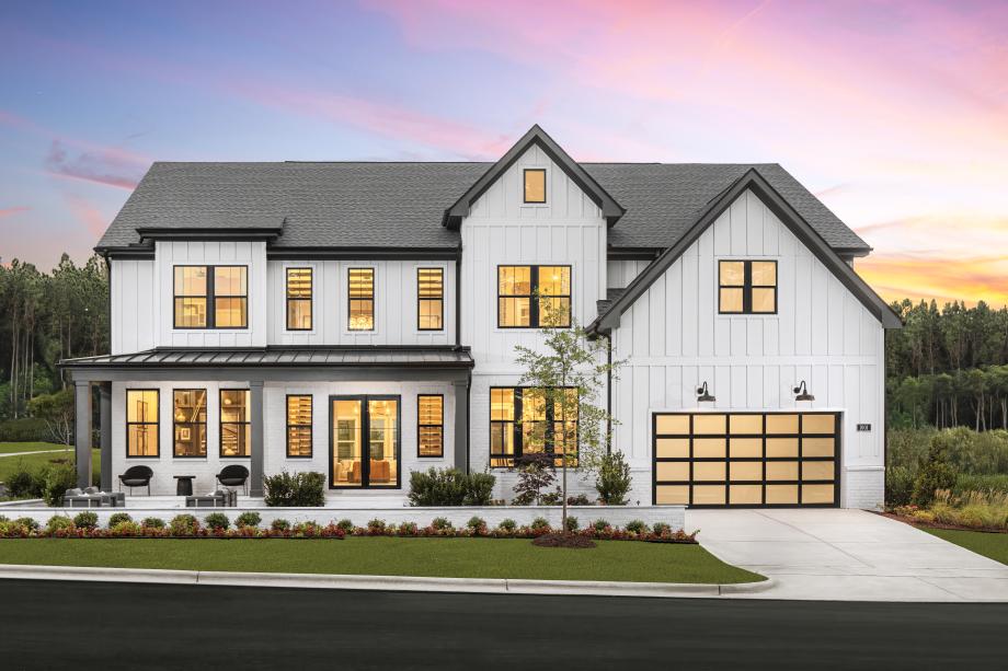 Beautifully designed Halstead Modern Farmhouse exterior with professionally landscaped surroundings