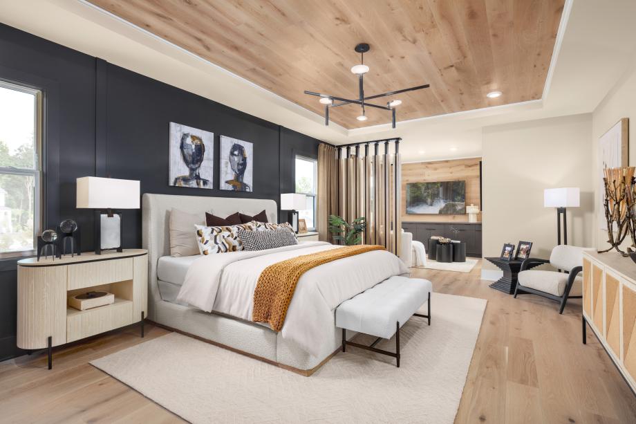Generously sized primary bedroom featuring a spacious retreat for relaxing