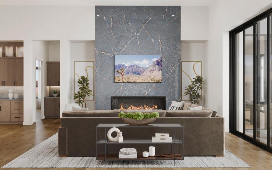 Impressive great room with a striking fireplace, ample seating space, and direct patio access