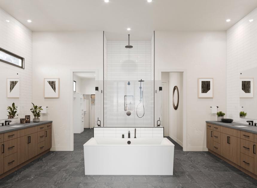 Expansive primary bathroom with two vanities, standalone soaking tub, and sizable walk-in closet