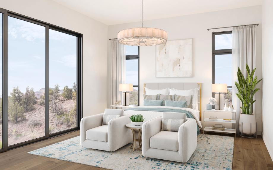 Primary bedroom suite with striking desert views and an abundance of natural light