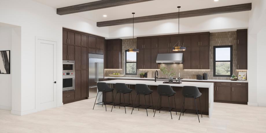 Beautiful kitchen with oversized island, stacked cabinets, and stainless steel appliances