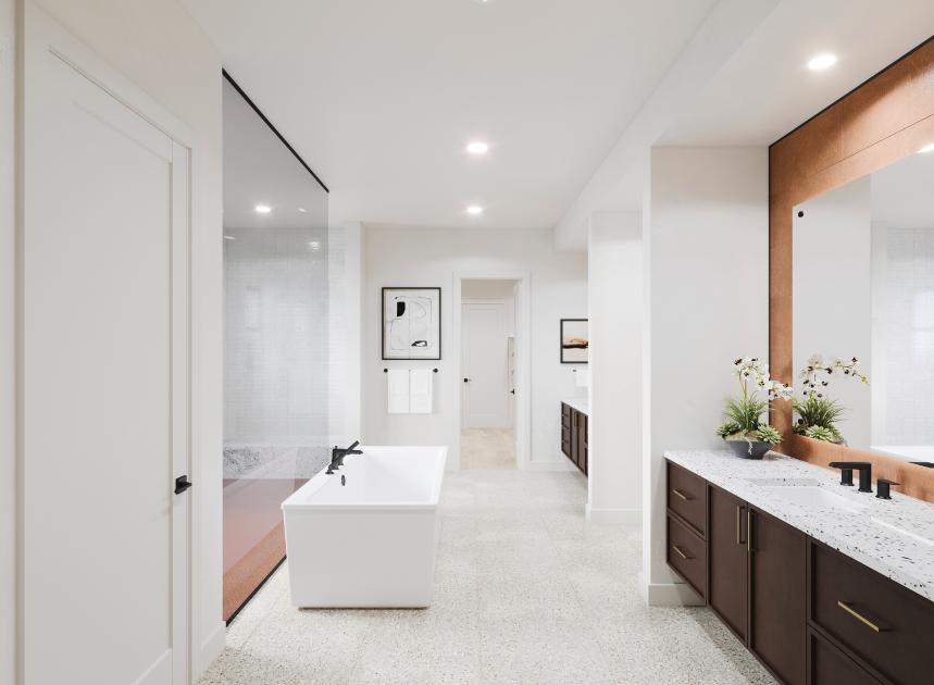 Spa-like primary bathroom with a large walk-in shower and freestanding soaking tub
