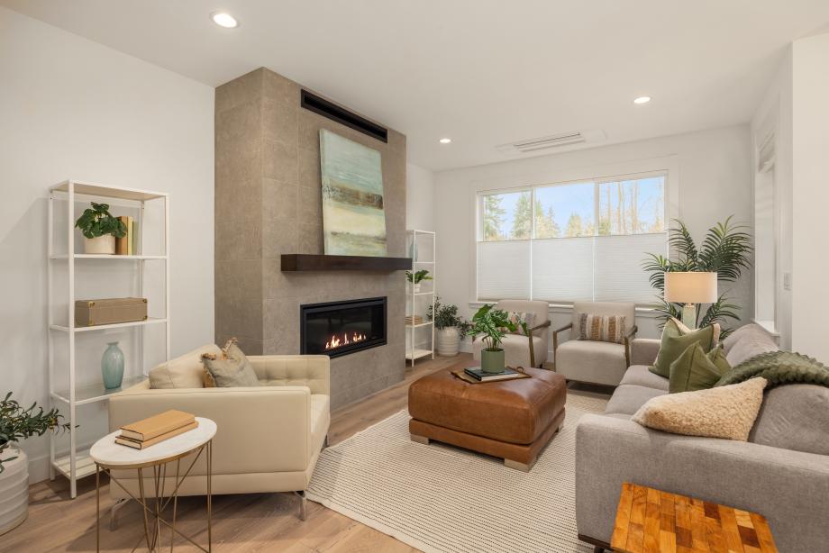 Cozy gas fireplace with floor-to-ceiling tile surround