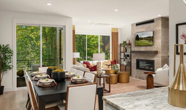 Views of the great room and greenbelt from the kitchen