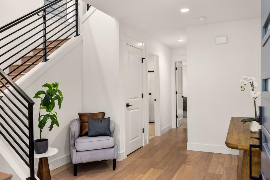 Entry foyer stairs with contemporary metal stair railing