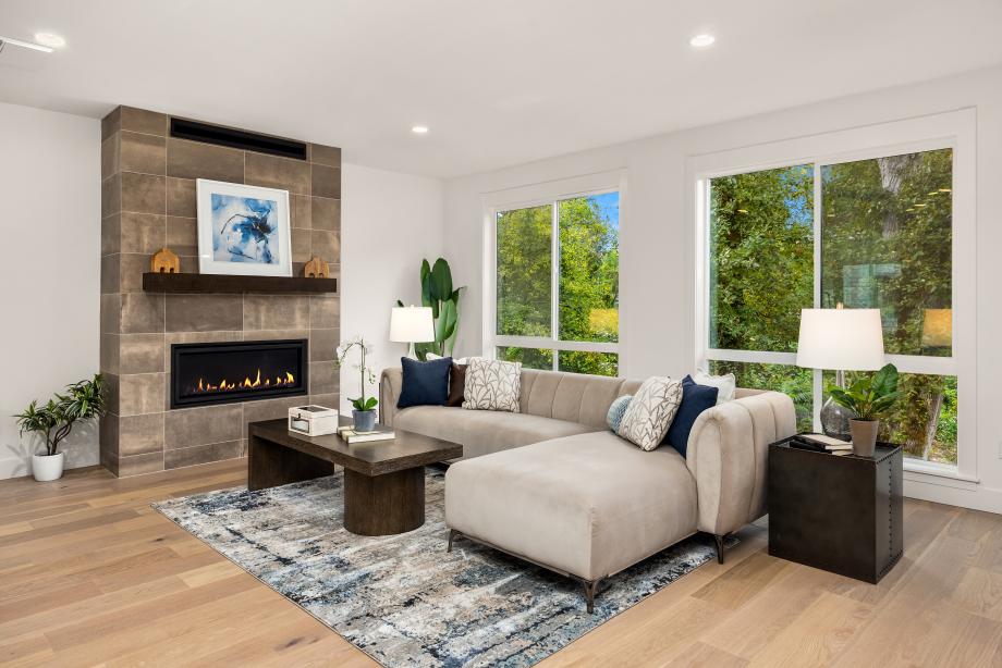 Cozy gas fireplace with floor-to-ceiling tile surround
