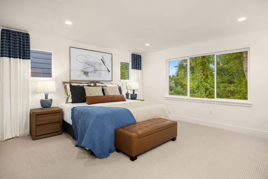Primary bedroom suite with greenbelt views