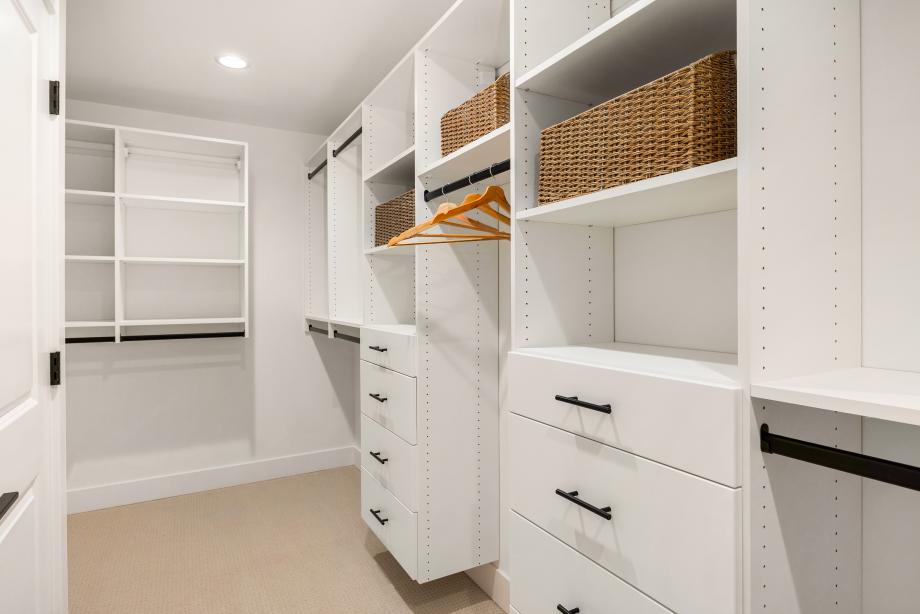 Custom closet system in the primary suite
