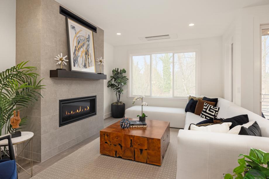Floor-to-ceiling tile surround on the gas fireplace