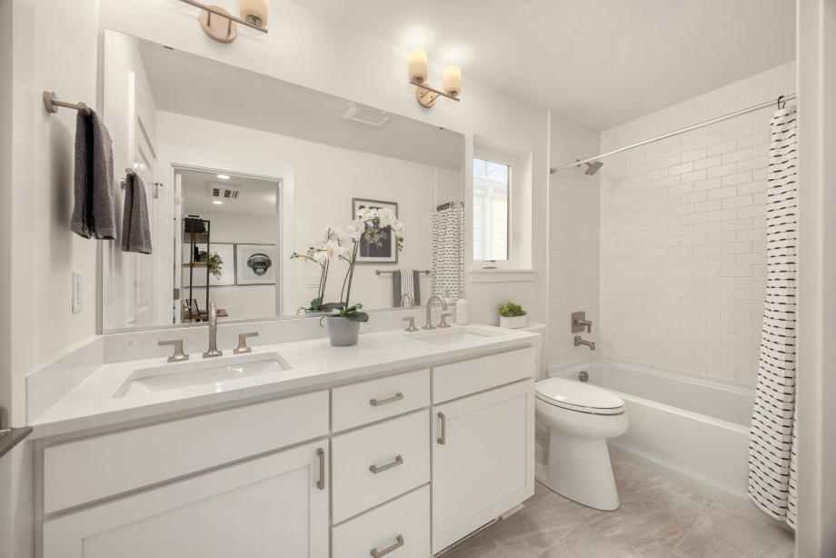Shared bathroom with double sinks