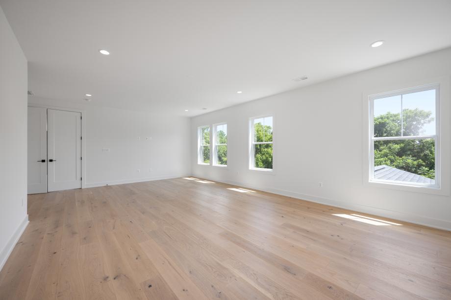 Large primary bedroom suite with dual walk-in closets