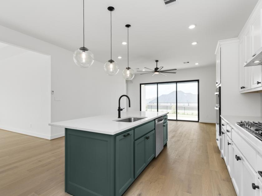 Gourmet kitchen with designer-appointed features and formal dining space