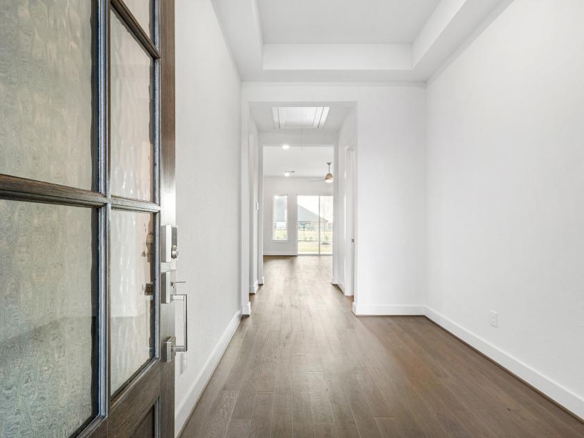 Elongated foyer leads to the open-concept great room