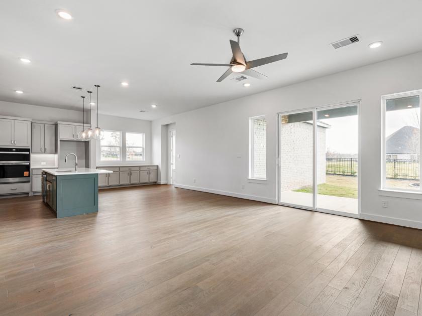 Kitchen with casual dining space and backyard views