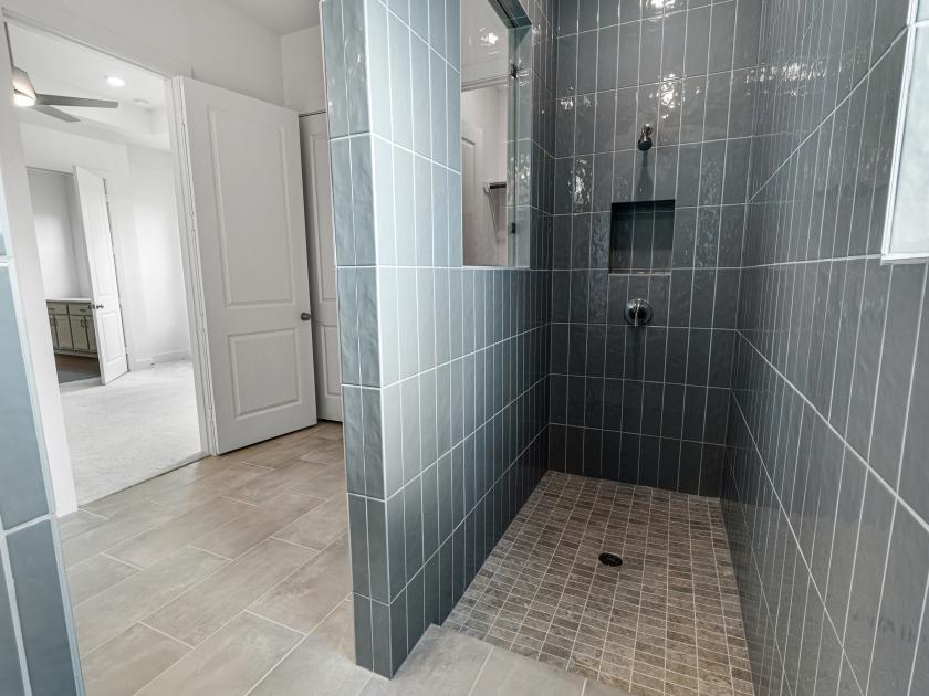 Spa-inspired primary bathroom with expansive shower