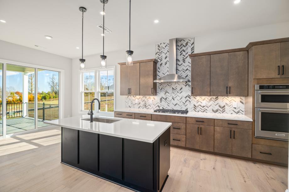 Stunning kitchen with casual dining area that leads out to covered deck