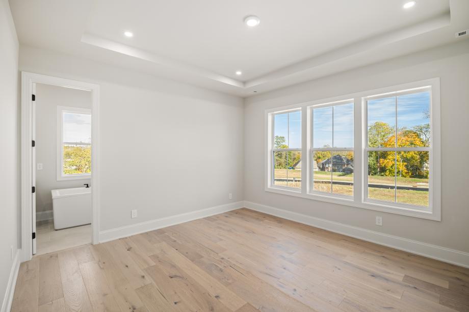 Primary bedroom with plentiful natural light
