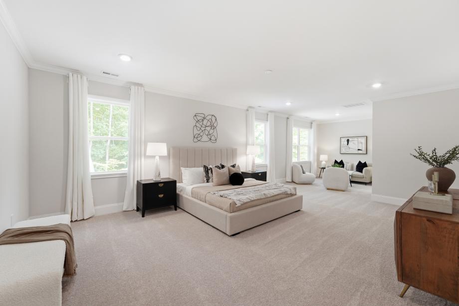 Luxurious primary bedroom with a versatile retreat