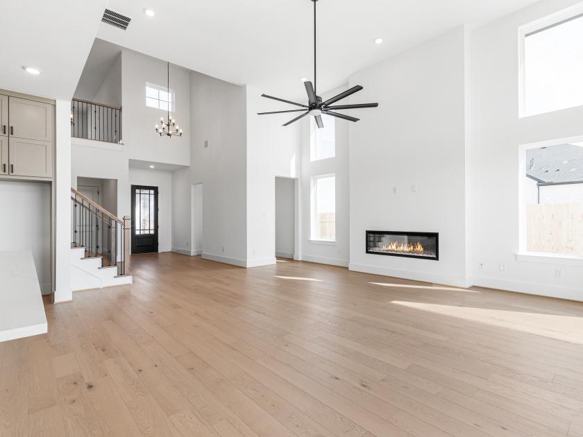 Great room with fireplace and high ceilings