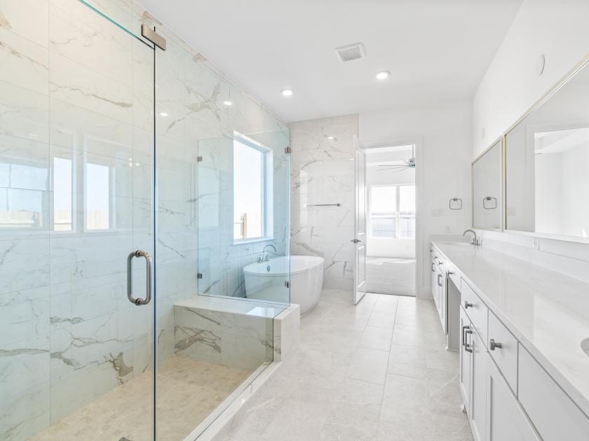Primary bathroom with standalone tub and shower