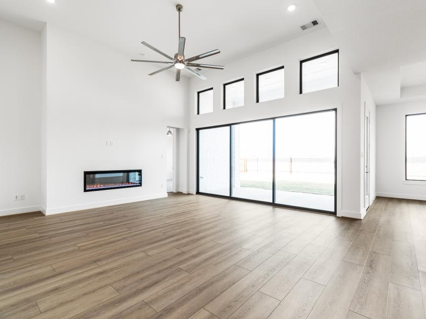 Great room with sliding glass doors and a fireplace