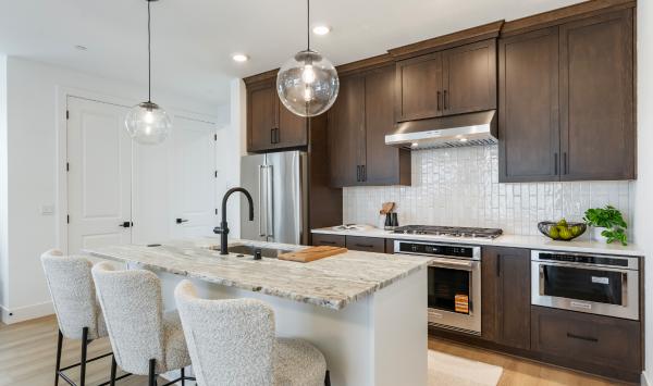 Well-appointed kitchen combines modern appliances with warm finishes for a welcoming feel