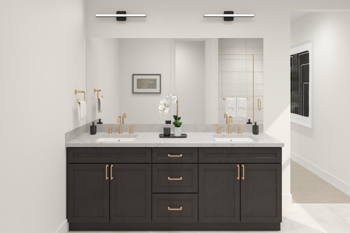 Primary bathroom with dual-sink vanity and glass shower door