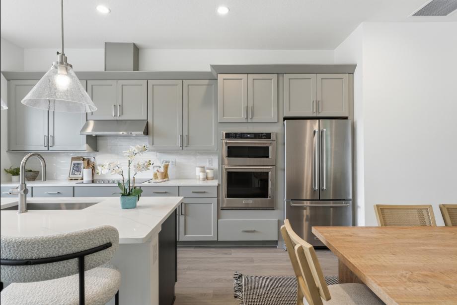 Gourmet kitchen boasting a large center island with quartz countertops