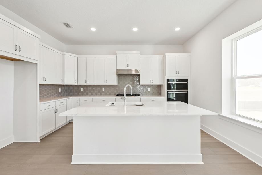 Well-equipped kitchen with beautiful cabinets and ample countertop space