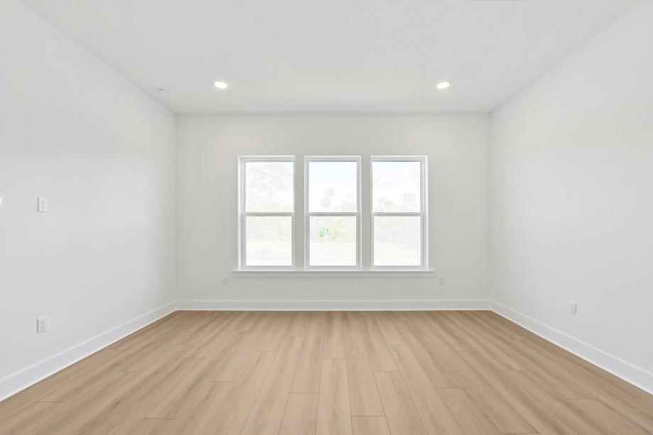 Primary bedroom suite with ample natural light